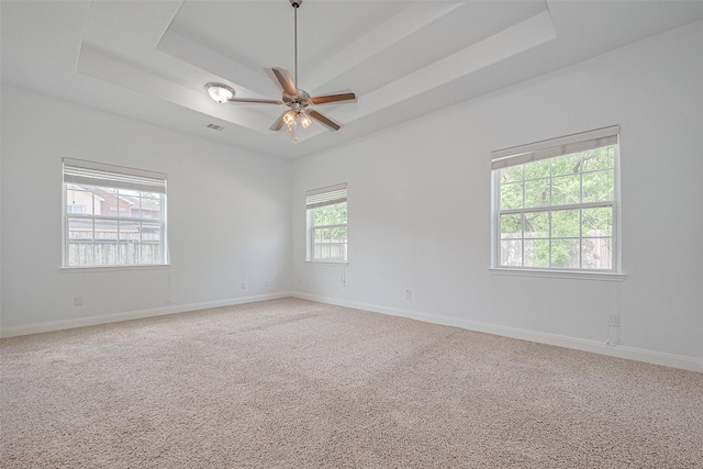 2403 Ranna Ct, Sugar Land, TX 77498 - empty room featuring a raised ceiling, light carpet, and a ceiling fan