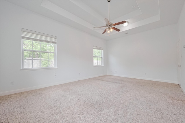 2403 Ranna Ct, Sugar Land, TX 77498 - spare room with a tray ceiling, a ceiling fan, and carpet