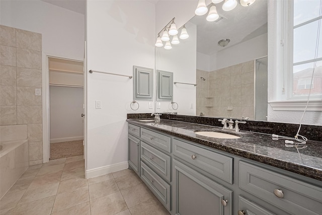 2403 Ranna Ct, Sugar Land, TX 77498 - full bathroom with double vanity, tile patterned floors, a bath, and tiled shower