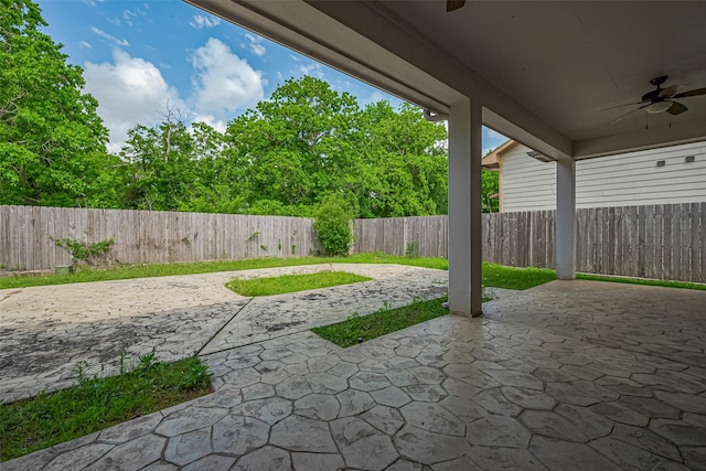 2403 Ranna Ct, Sugar Land, TX 77498 - fenced backyard featuring a ceiling fan and a patio area