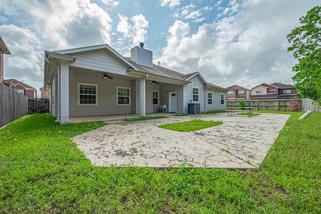 2403 Ranna Ct, Sugar Land, TX 77498 - back of property with ceiling fan, a patio area, a chimney, and a fenced backyard