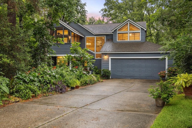 11 Leaf Trace Ct, Spring, TX 77381 - view of front of house with driveway, a shingled roof, and a garage