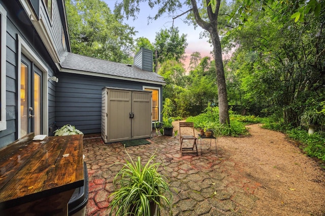 11 Leaf Trace Ct, Spring, TX 77381 - patio terrace at dusk with a patio area
