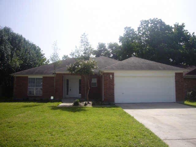11514 Musetta Ct, Cypress, TX 77429 - ranch-style house featuring a garage, a front lawn, driveway, and brick siding