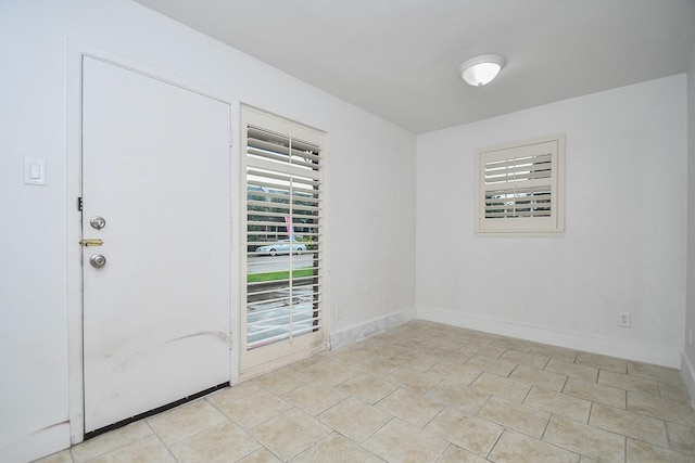 2635 Marilee Ln Unit 2635, Houston, TX 77057 - spare room featuring baseboards and light tile patterned floors
