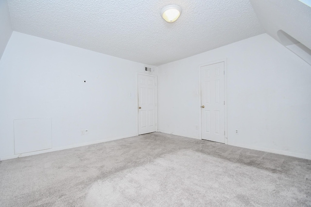 2635 Marilee Ln Unit 2635, Houston, TX 77057 - bonus room featuring carpet flooring and a textured ceiling