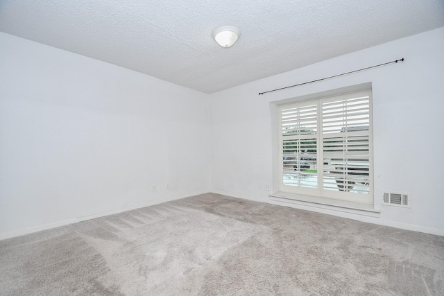 2635 Marilee Ln Unit 2635, Houston, TX 77057 - carpeted spare room featuring a textured ceiling and baseboards