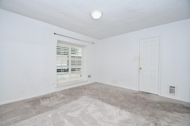 2635 Marilee Ln Unit 2635, Houston, TX 77057 - carpeted empty room featuring a textured ceiling and baseboards