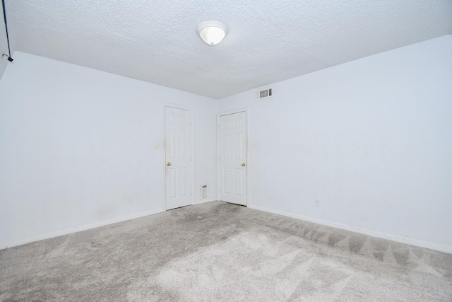 2635 Marilee Ln Unit 2635, Houston, TX 77057 - empty room featuring carpet floors and a textured ceiling