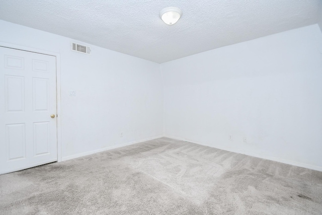 2635 Marilee Ln Unit 2635, Houston, TX 77057 - carpeted empty room with baseboards and a textured ceiling