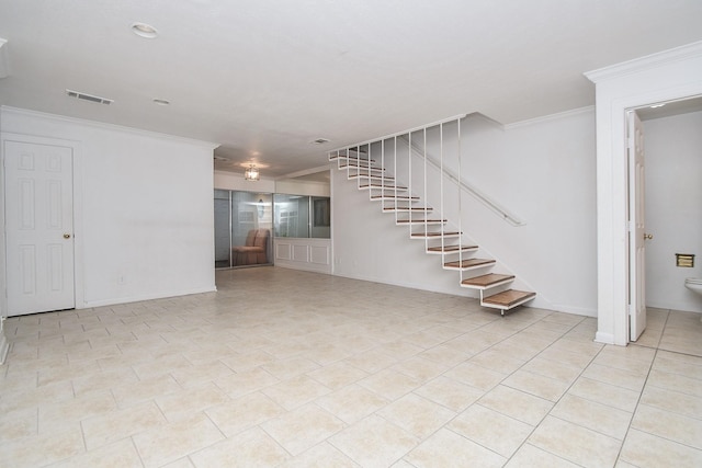 2635 Marilee Ln Unit 2635, Houston, TX 77057 - unfurnished living room featuring ornamental molding and stairway