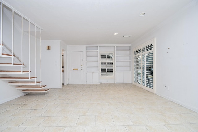 2635 Marilee Ln Unit 2635, Houston, TX 77057 - empty room featuring built in shelves, ornamental molding, recessed lighting, and stairs
