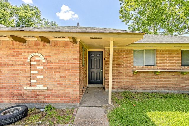 11058 Vailview Dr, Houston, TX 77016 - property entrance featuring brick siding and roof with shingles