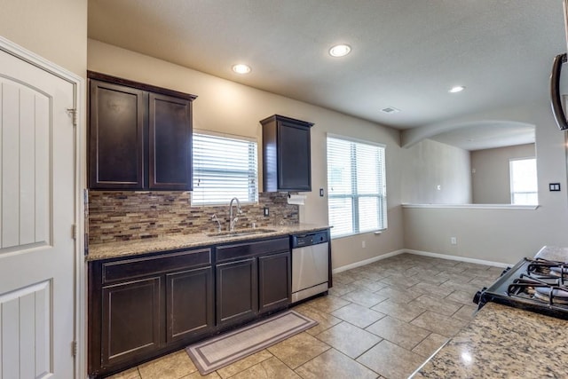 23606 Stargazer Pt, Spring, TX 77373 - kitchen with dishwasher, tasteful backsplash, recessed lighting, black gas range oven, and dark brown cabinets