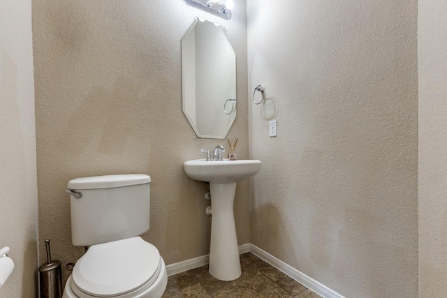 23606 Stargazer Pt, Spring, TX 77373 - half bath with toilet and tile patterned floors