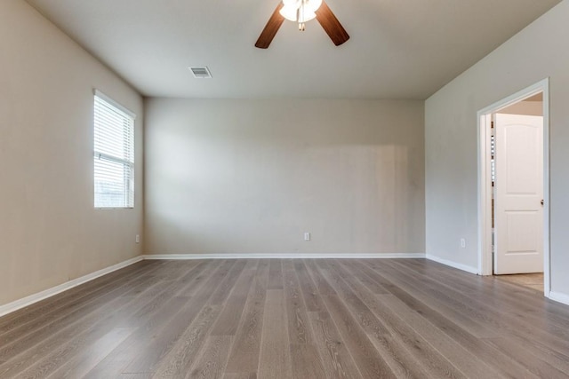 23606 Stargazer Pt, Spring, TX 77373 - spare room featuring light wood-type flooring and ceiling fan