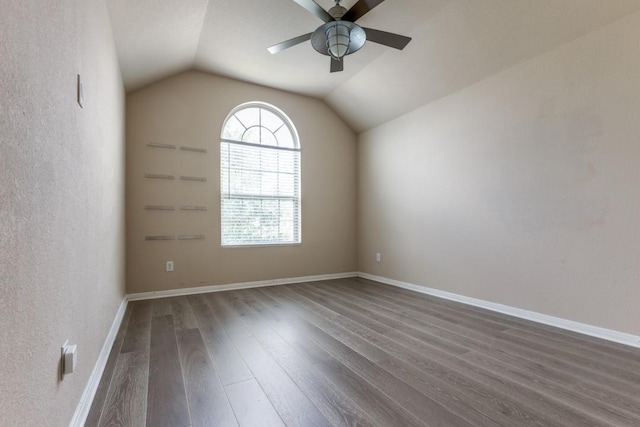 23606 Stargazer Pt, Spring, TX 77373 - spare room with dark wood finished floors, a ceiling fan, and lofted ceiling