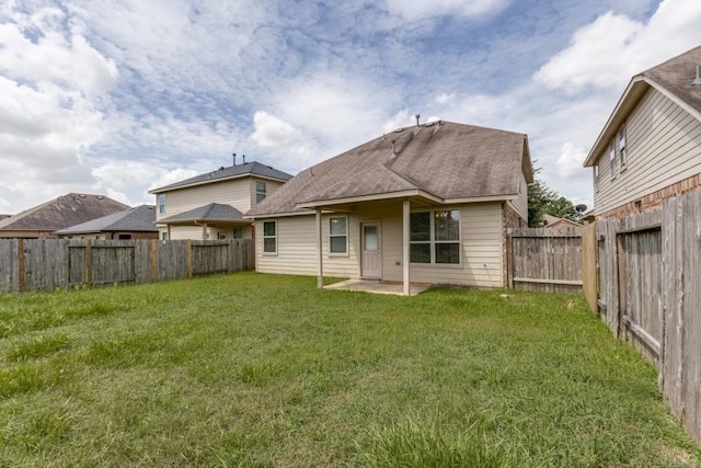 23606 Stargazer Pt, Spring, TX 77373 - back of house with a fenced backyard, roof with shingles, and a patio area