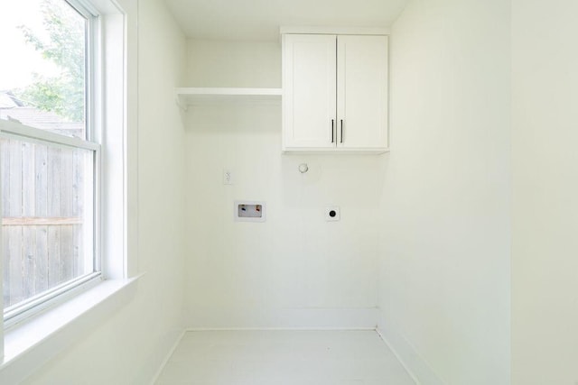 1020 E 16th St, Houston, TX 77009 - washroom featuring hookup for a washing machine, electric dryer hookup, cabinet space, and healthy amount of natural light