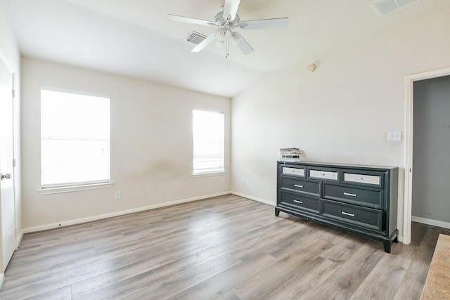 2526 Hidden Park Ln, Conroe, TX 77385 - unfurnished bedroom featuring light wood-style floors, vaulted ceiling, and a ceiling fan