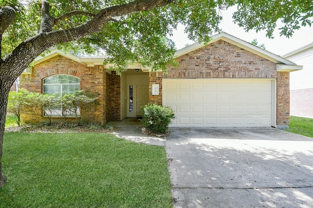 2526 Hidden Park Ln, Conroe, TX 77385 - view of front of property with brick siding, driveway, a garage, and a front lawn