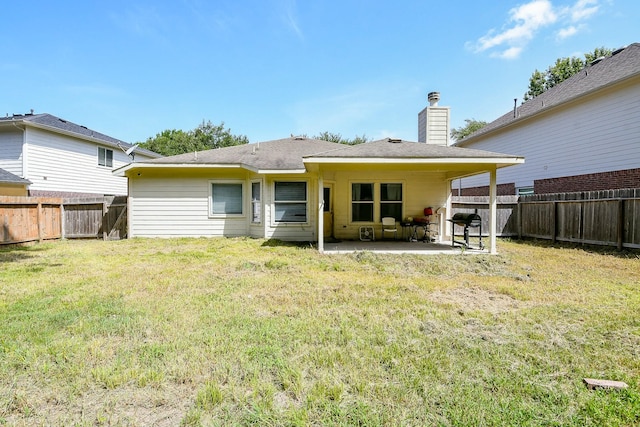 2526 Hidden Park Ln, Conroe, TX 77385 - back of house with a patio, a fenced backyard, and a chimney