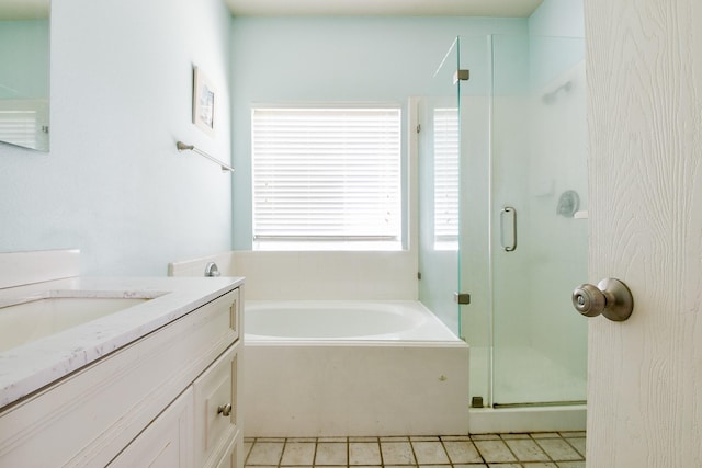 2526 Hidden Park Ln, Conroe, TX 77385 - full bathroom featuring vanity, a stall shower, and a garden tub