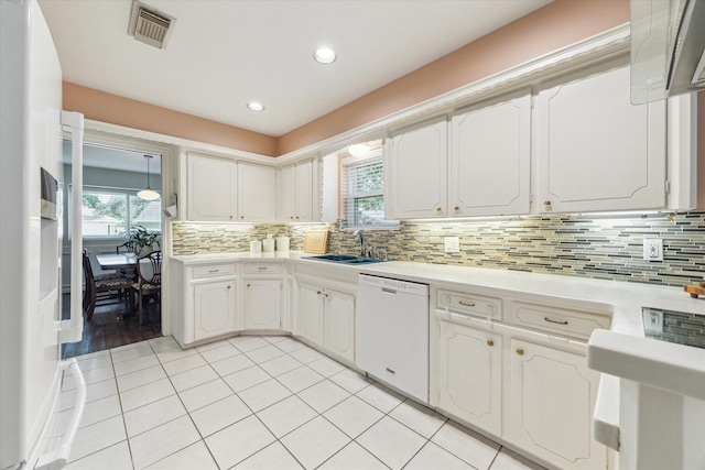10050 Locke Ln, Houston, TX 77042 - kitchen with white appliances, decorative backsplash, light countertops, light tile patterned floors, and recessed lighting