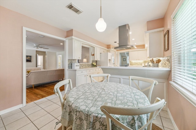 10050 Locke Ln, Houston, TX 77042 - dining space with light tile patterned flooring, a ceiling fan, and recessed lighting