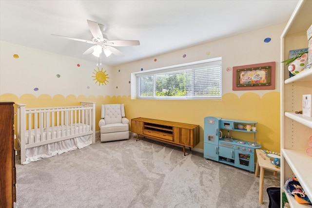10050 Locke Ln, Houston, TX 77042 - carpeted bedroom featuring a crib and ceiling fan