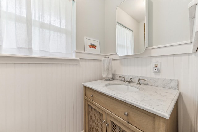 10050 Locke Ln, Houston, TX 77042 - bathroom with vanity and wainscoting