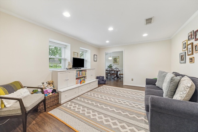 10050 Locke Ln, Houston, TX 77042 - living area with ornamental molding, dark wood-style floors, and recessed lighting