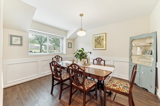 10050 Locke Ln, Houston, TX 77042 - dining space with wood finished floors, a decorative wall, and a wainscoted wall