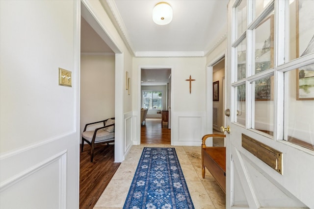 10050 Locke Ln, Houston, TX 77042 - foyer with ornamental molding, wainscoting, and a decorative wall