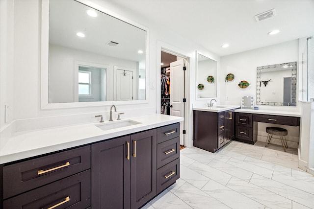 1247 Martin St, Houston, TX 77018 - full bathroom with marble finish floors, two vanities, recessed lighting, and a walk in closet