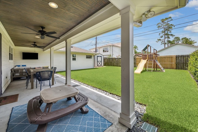 1247 Martin St, Houston, TX 77018 - fenced backyard with a patio area, outdoor dining area, a storage shed, a ceiling fan, and a playground