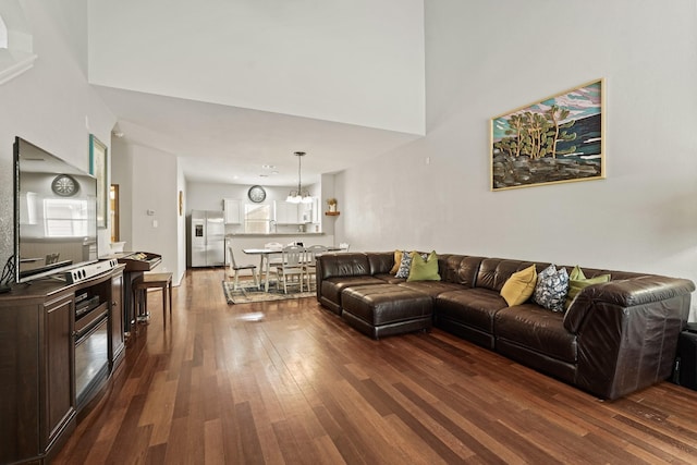 2911 Clay St, Houston, TX 77003 - living room featuring dark wood-style floors and a chandelier
