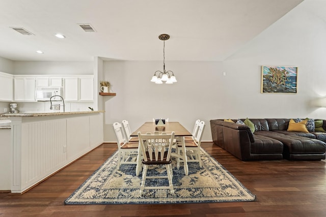 2911 Clay St, Houston, TX 77003 - dining room with dark wood-style flooring, a chandelier, and recessed lighting