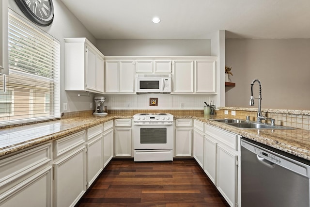 2911 Clay St, Houston, TX 77003 - kitchen featuring white appliances, white cabinetry, dark wood-type flooring, light stone countertops, and recessed lighting