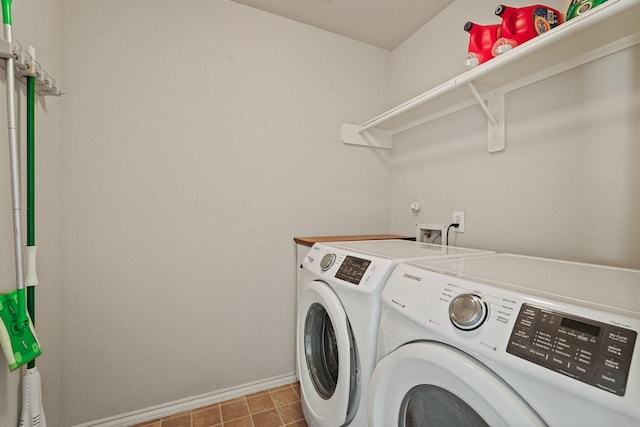 2911 Clay St, Houston, TX 77003 - laundry area with washing machine and clothes dryer and baseboards