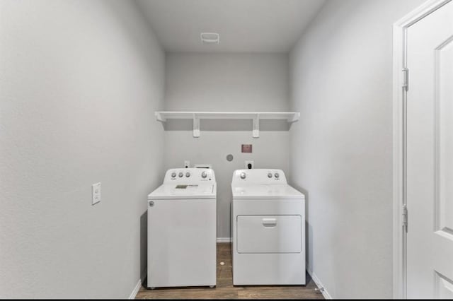 23322 Pelham Prairie Ln, Spring, TX 77373 - laundry area with washing machine and dryer and wood finished floors
