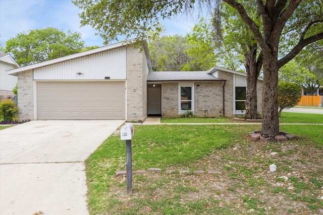 11331 Woollcott St, San Antonio, TX 78251 - mid-century modern home with brick siding, a garage, concrete driveway, and a front yard