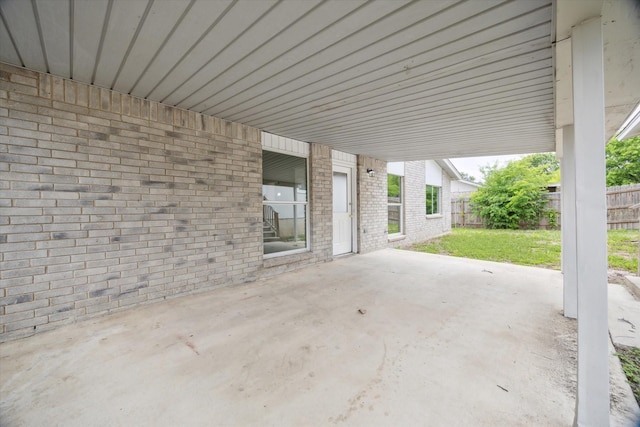 11331 Woollcott St, San Antonio, TX 78251 - fenced backyard with a patio and an attached carport