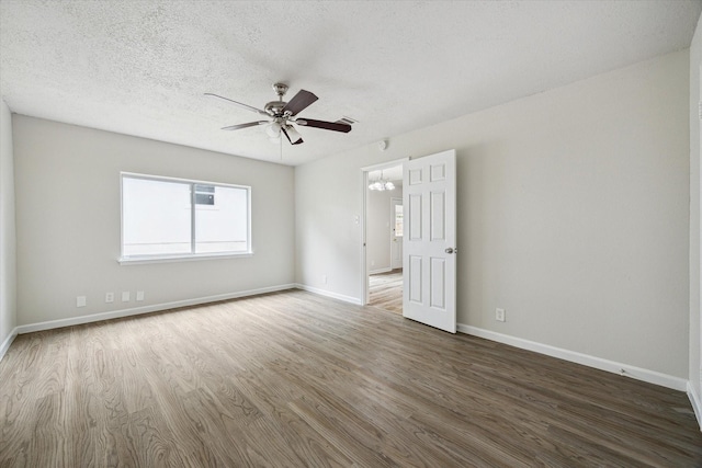 11331 Woollcott St, San Antonio, TX 78251 - empty room featuring wood finished floors, a ceiling fan, and a textured ceiling