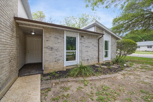 11331 Woollcott St, San Antonio, TX 78251 - view of exterior entry featuring brick siding