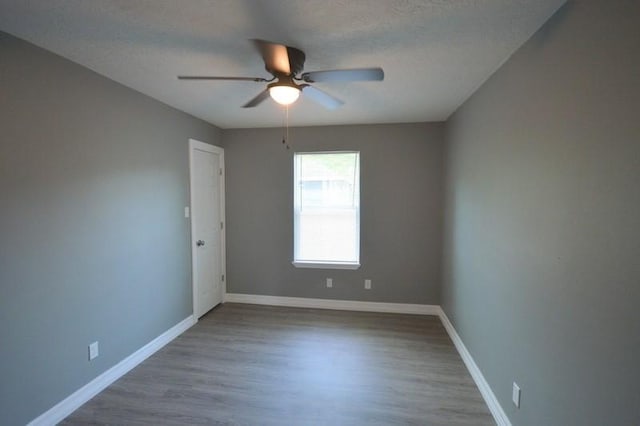 3007 Tuam St, Houston, TX 77004 - empty room with ceiling fan, wood finished floors, and a textured ceiling