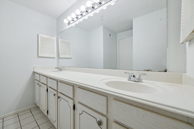 1100 Augusta Dr Unit 63, Houston, TX 77057 - full bathroom featuring double vanity, tile patterned floors, and a textured ceiling