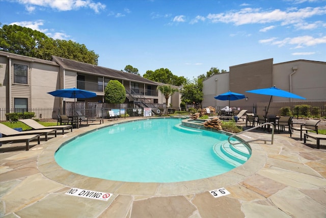 1100 Augusta Dr Unit 63, Houston, TX 77057 - view of swimming pool featuring a patio and a pool with connected hot tub