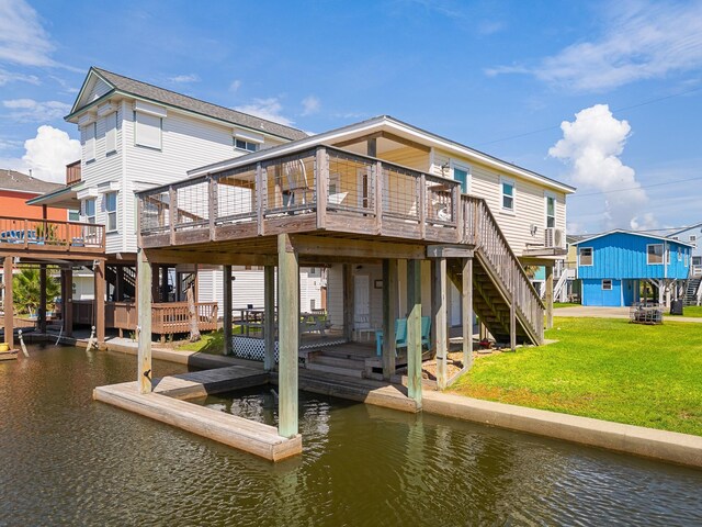 16711 Kingston Way, Galveston, TX 77554 - dock with stairs, a deck with water view, and a yard