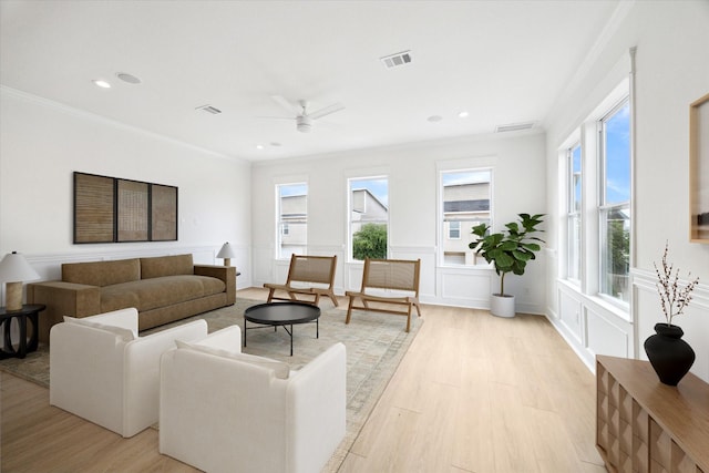 306 Felt Cir, Houston, TX 77011 - living area featuring light wood-style flooring, ornamental molding, ceiling fan, recessed lighting, and a decorative wall